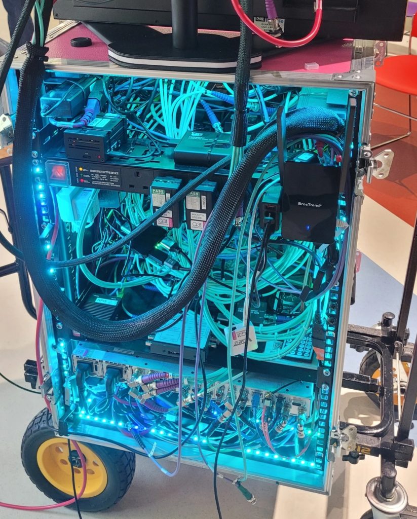 BigPinkDemoKit IP Rack REAR(John Sparrow) Rear view of the IP Demo rack showing lots of wires and other smaller devices mounted to shelves